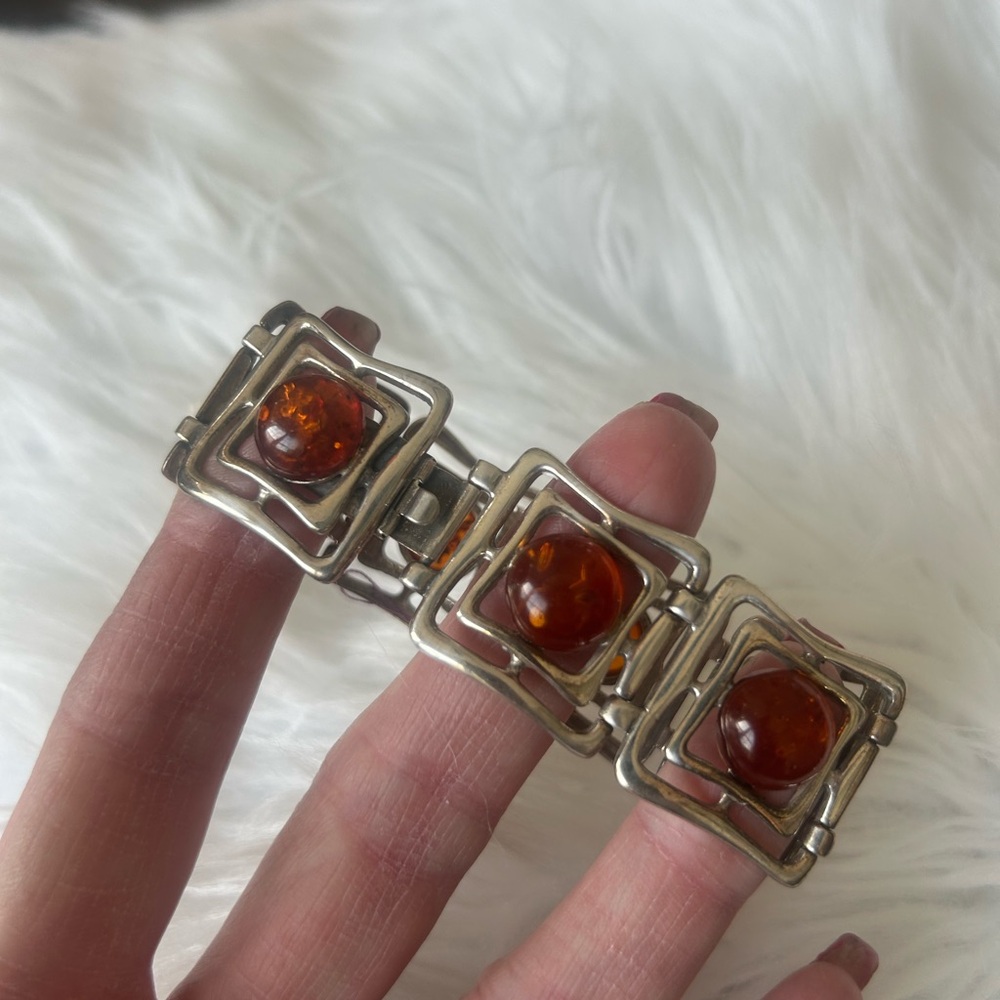 Silver and Orange Geometric Bracelet with Intricate Design